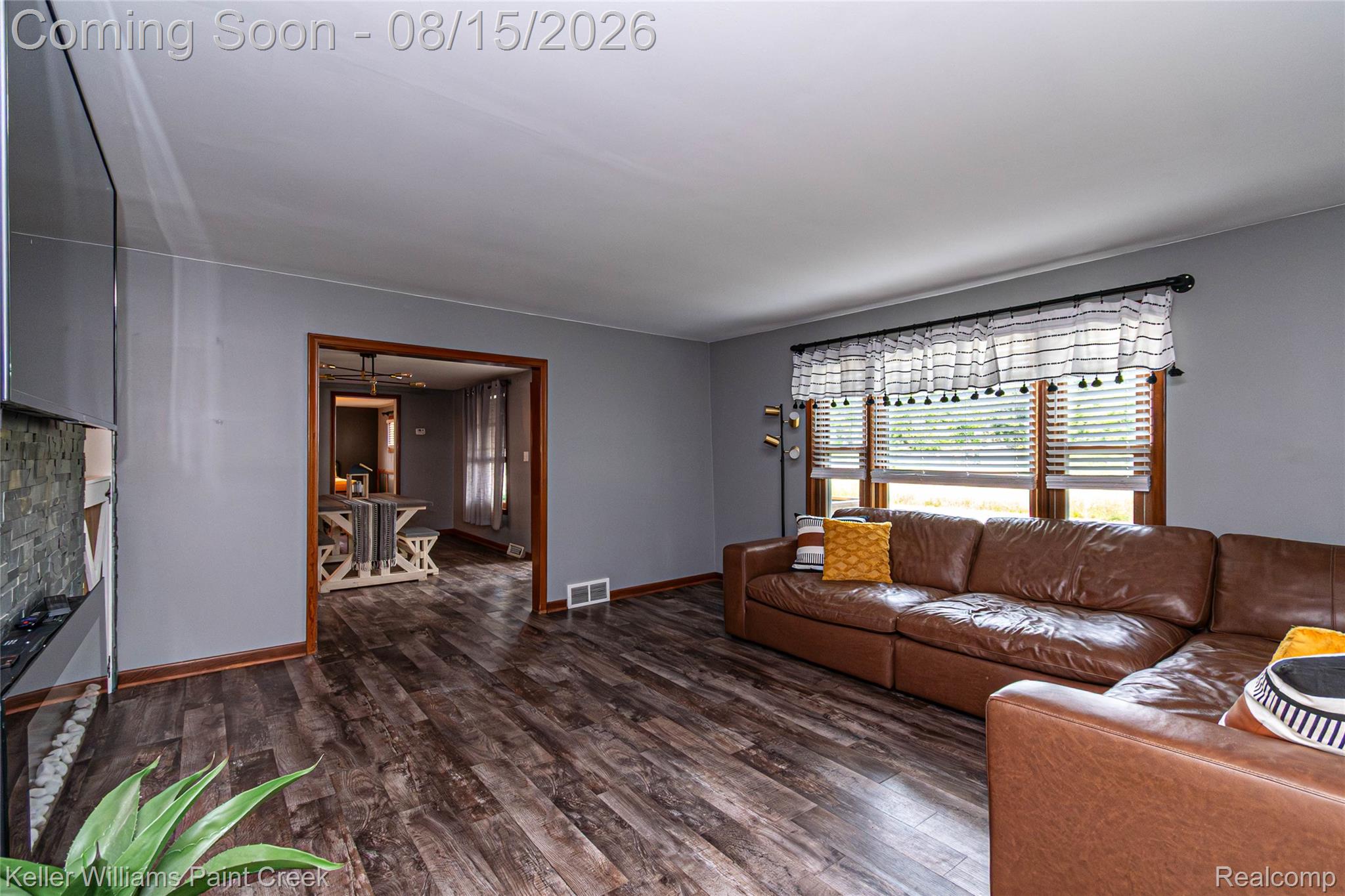 330 East Washington Street Romeo, MI 48065 - Photo 29 of 68 Wood-finish flooring throughout, framed doorway, and a window with blinds