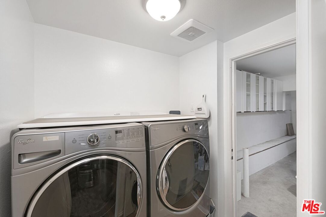 4240 Lost Hills Road, Unit 2602 Calabasas, CA 91301 - Photo 15 of 38 a utility room with dryer and washer