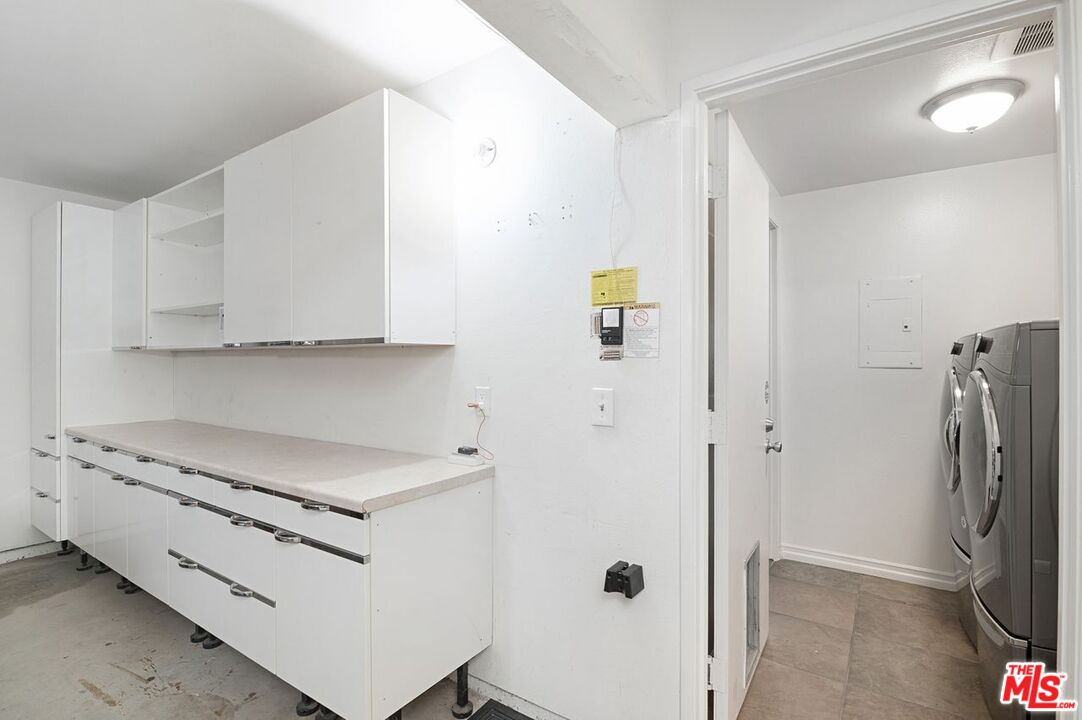 4240 Lost Hills Road, Unit 2602 Calabasas, CA 91301 - Photo 16 of 38 a kitchen with stainless steel appliances a refrigerator and a stove top oven
