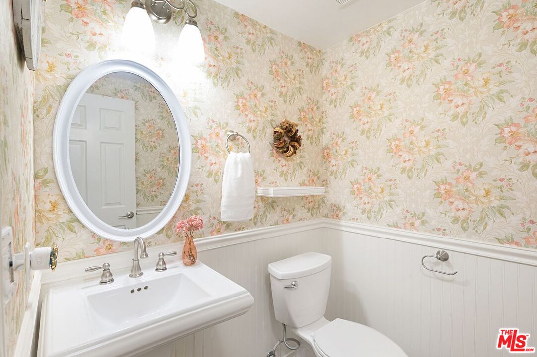 4240 Lost Hills Road, Unit 2602 Calabasas, CA 91301 - Photo 17 of 38 a bathroom with a sink mirror vanity and toilet