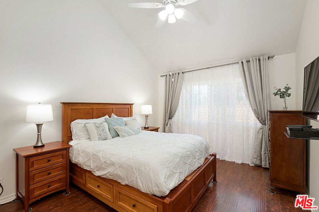 4240 Lost Hills Road, Unit 2602 Calabasas, CA 91301 - Photo 19 of 38 a bedroom with a bed and a flat tv screen on a dresser