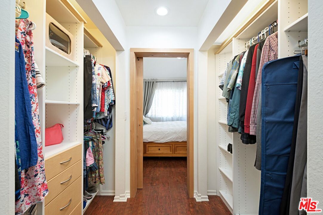 4240 Lost Hills Road, Unit 2602 Calabasas, CA 91301 - Photo 21 of 38 a view of walk in closet with clothes and shoes