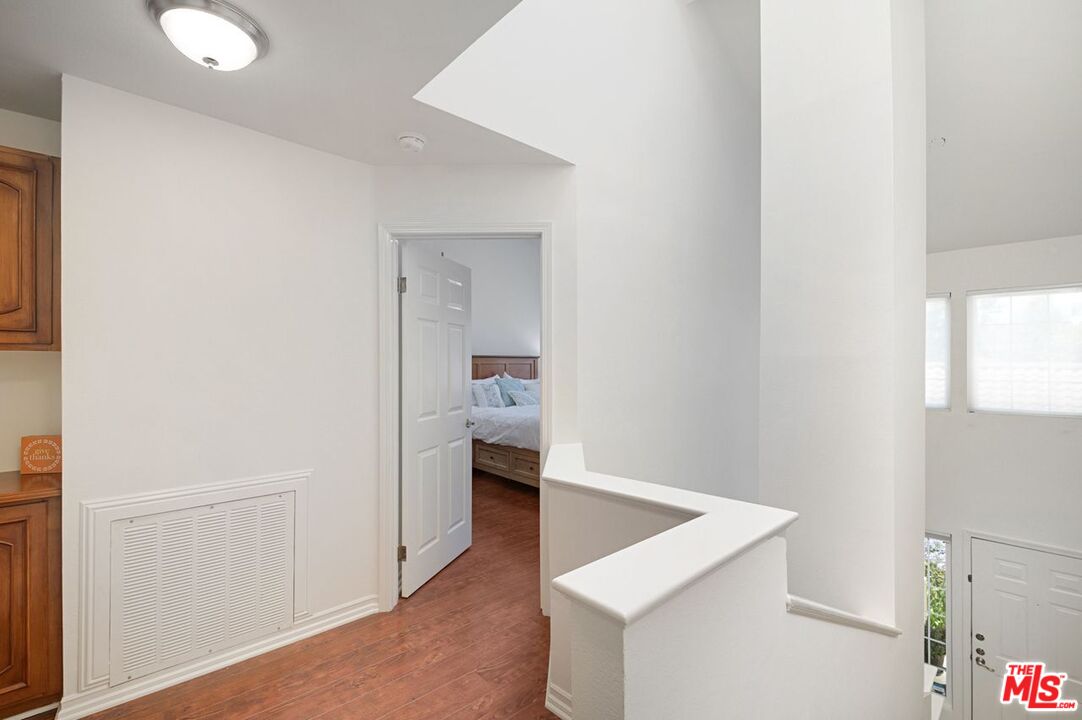 4240 Lost Hills Road, Unit 2602 Calabasas, CA 91301 - Photo 25 of 38 a view of hallway with wooden floor