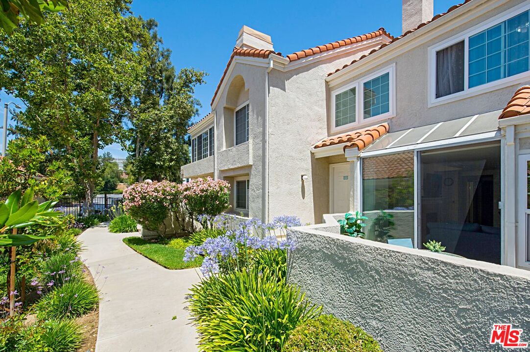 4240 Lost Hills Road, Unit 2602 Calabasas, CA 91301 - Photo 30 of 38 a front view of a house with a yard