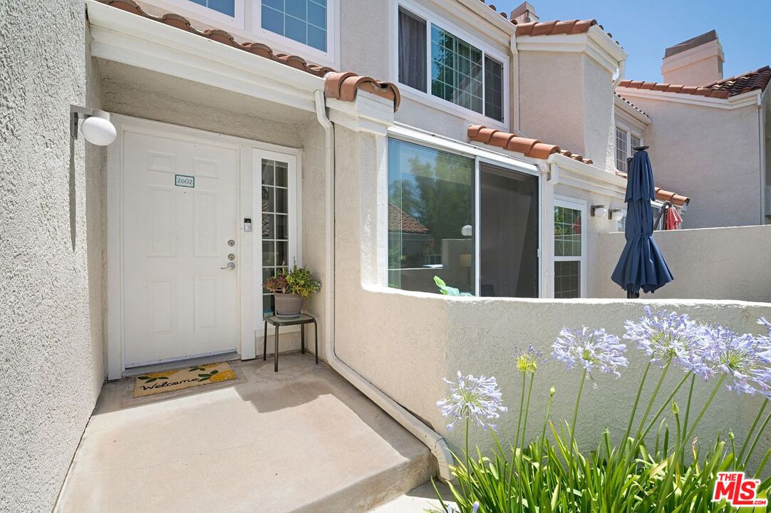 4240 Lost Hills Road, Unit 2602 Calabasas, CA 91301 - Photo 3 of 38 front view of a house with a potted plant