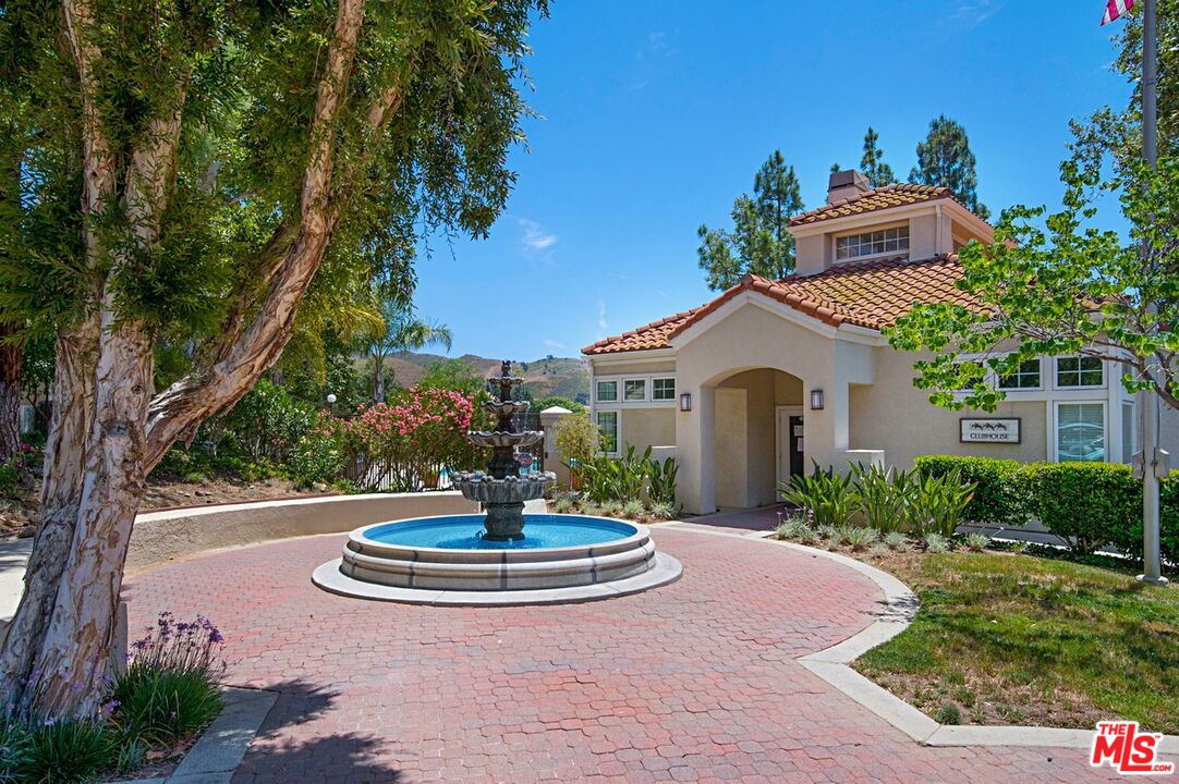 4240 Lost Hills Road, Unit 2602 Calabasas, CA 91301 - Photo 38 of 38 a house with a yard and a garden