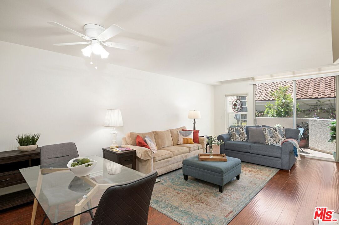 4240 Lost Hills Road, Unit 2602 Calabasas, CA 91301 - Photo 4 of 38 a living room with furniture and a large window