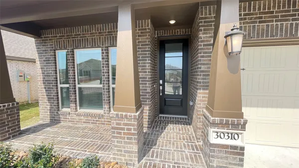 a view of a door and a window