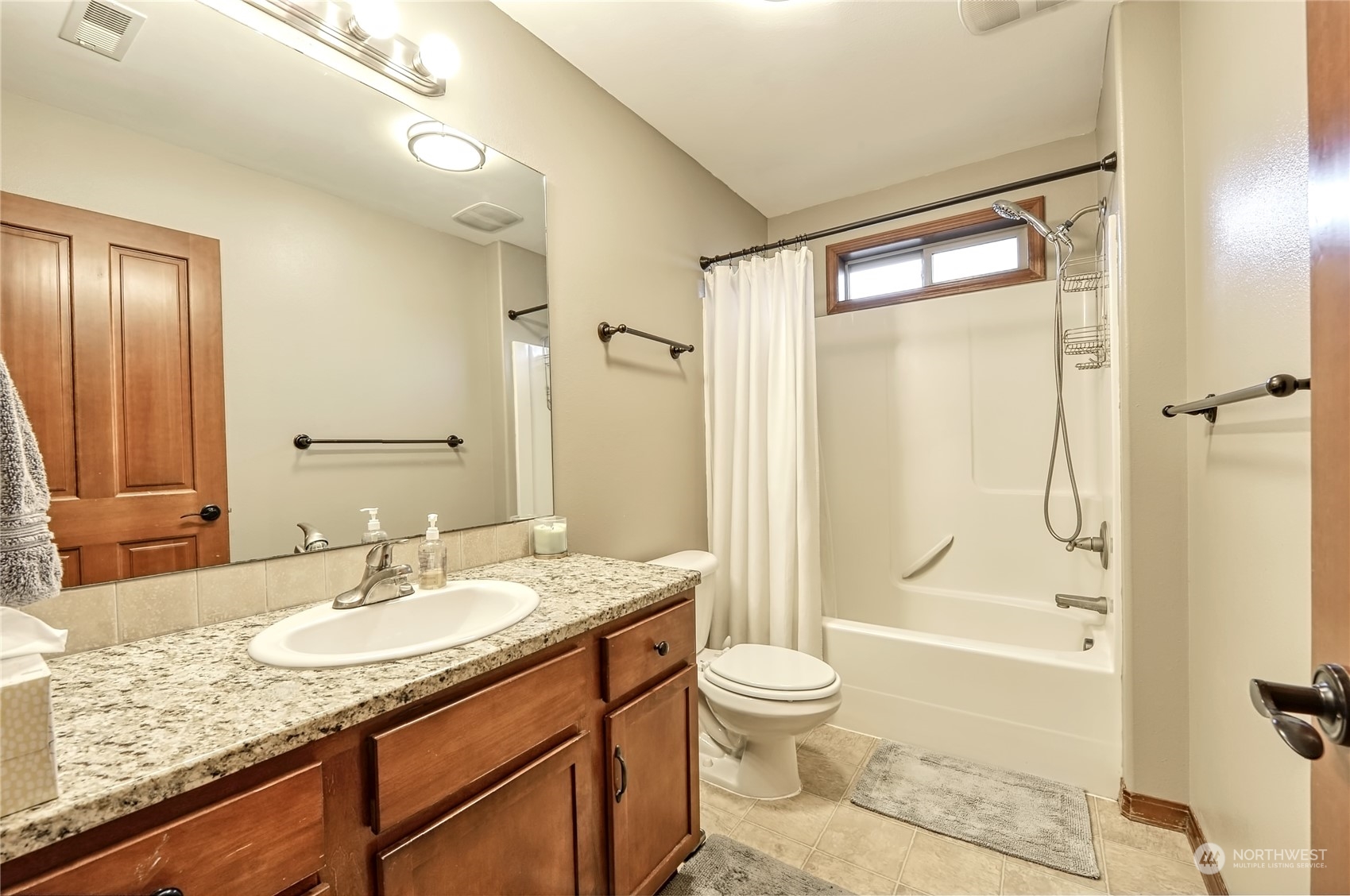 5576 Old Settler Drive Ferndale, WA 98248 - Photo 11 of 20 a bathroom with a granite countertop sink toilet and shower