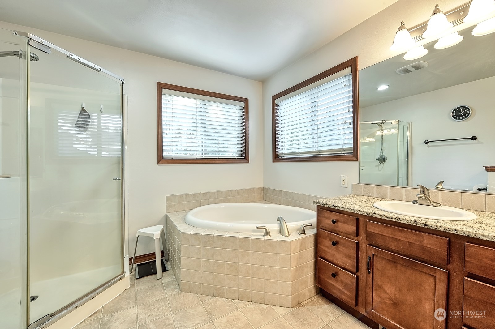 5576 Old Settler Drive Ferndale, WA 98248 - Photo 17 of 20 a bathroom with a tub sink and mirror