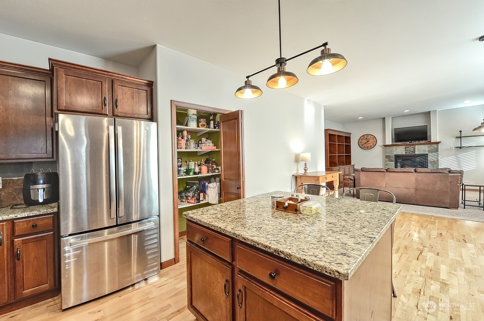 5576 Old Settler Drive Ferndale, WA 98248 - Photo 8 of 20 a kitchen with stainless steel appliances granite countertop a refrigerator a stove and a sink with cabinets