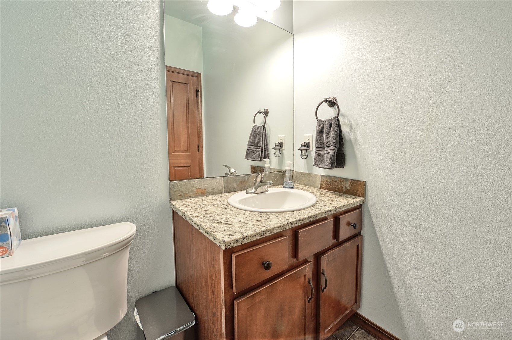 5576 Old Settler Drive Ferndale, WA 98248 - Photo 10 of 20 a bathroom with a granite countertop sink and a toilet