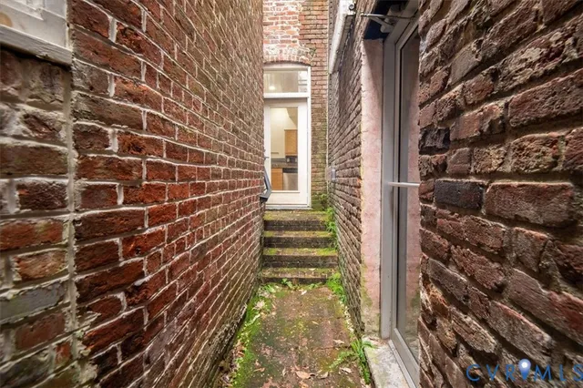 a view of a bench with wooden fence