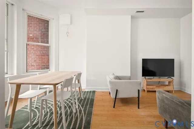 a view of a livingroom with furniture and a flat screen tv