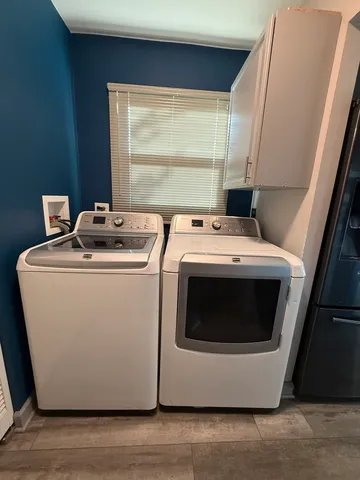 a utility room with dryer and washer