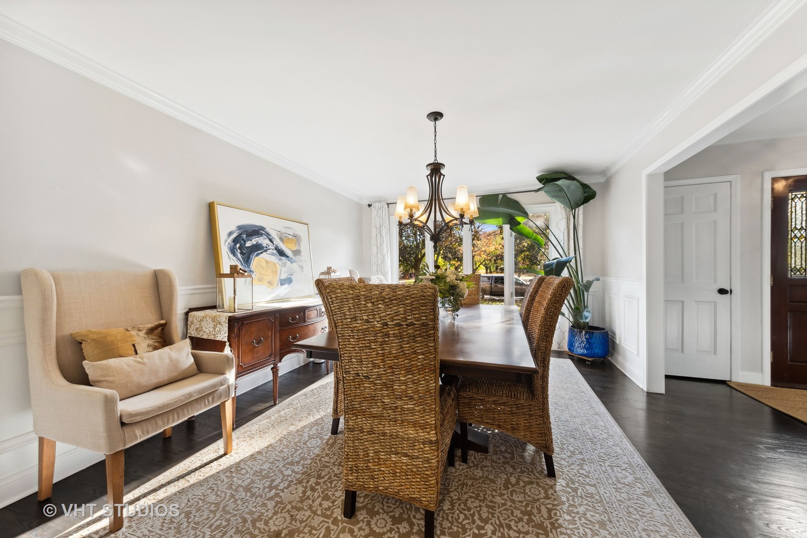 2S540 White Birch Lane Wheaton, IL 60189 - Photo 12 of 46 a dining room with furniture a rug a potted plant and wooden floor
