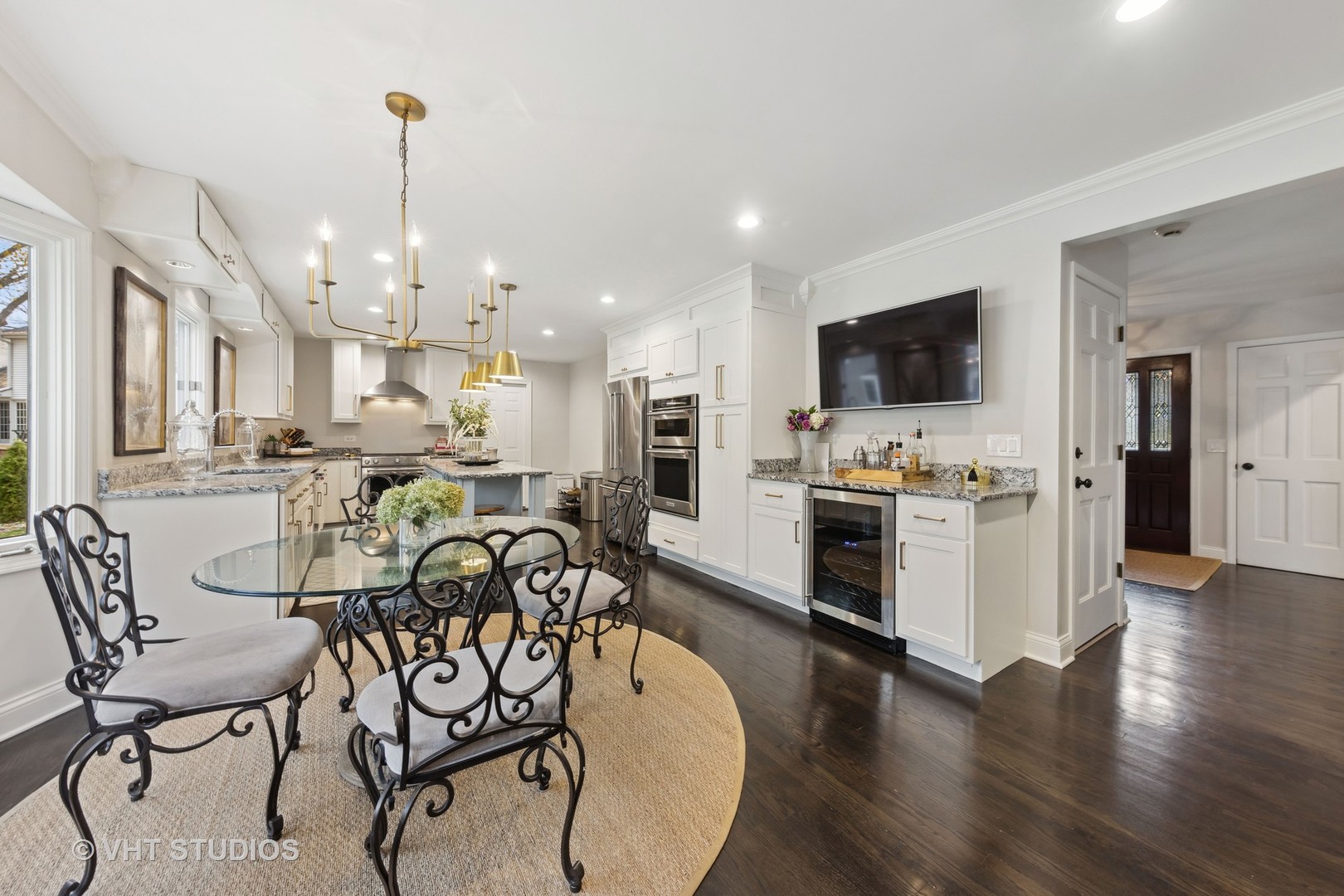 2S540 White Birch Lane Wheaton, IL 60189 - Photo 14 of 46 a view of a dining room and livingroom with furniture wooden floor a chandelier