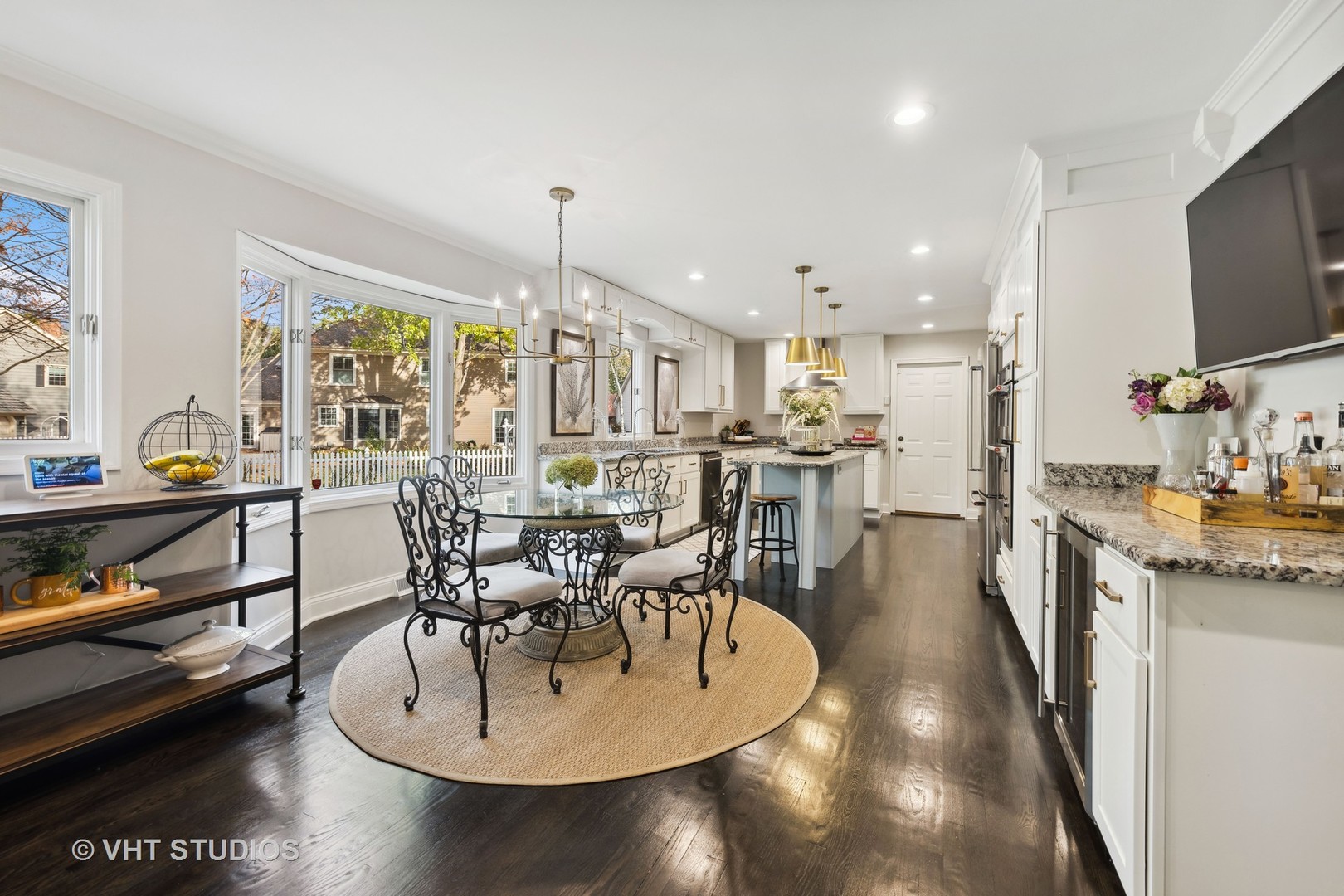 2S540 White Birch Lane Wheaton, IL 60189 - Photo 19 of 46 a dining room with furniture a wooden floor and a floor to ceiling window
