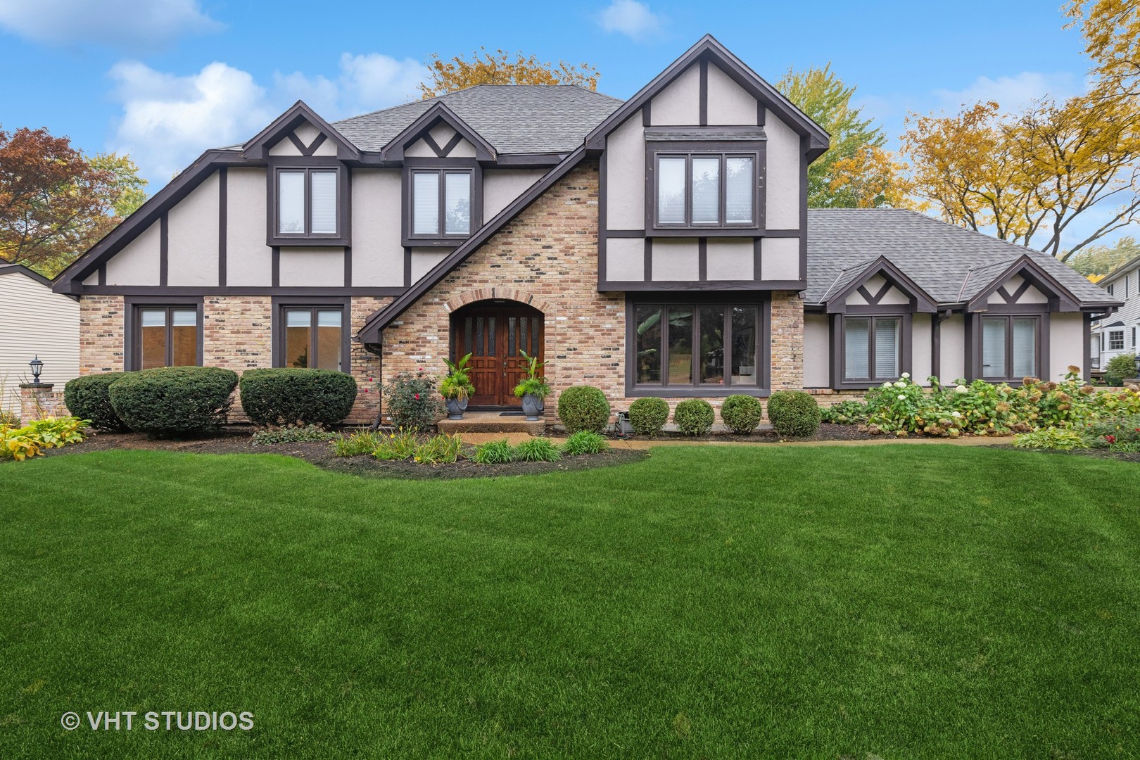 2S540 White Birch Lane Wheaton, IL 60189 - Photo 2 of 46 a front view of a house with a yard and porch