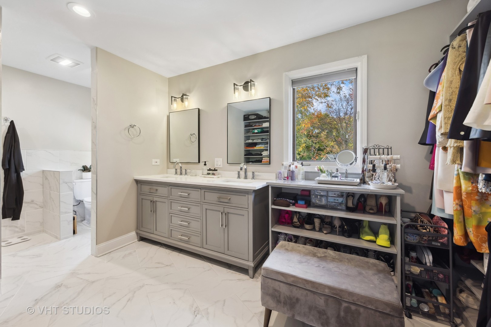 2S540 White Birch Lane Wheaton, IL 60189 - Photo 29 of 46 a bathroom with a double vanity sink a mirror and a bathtub