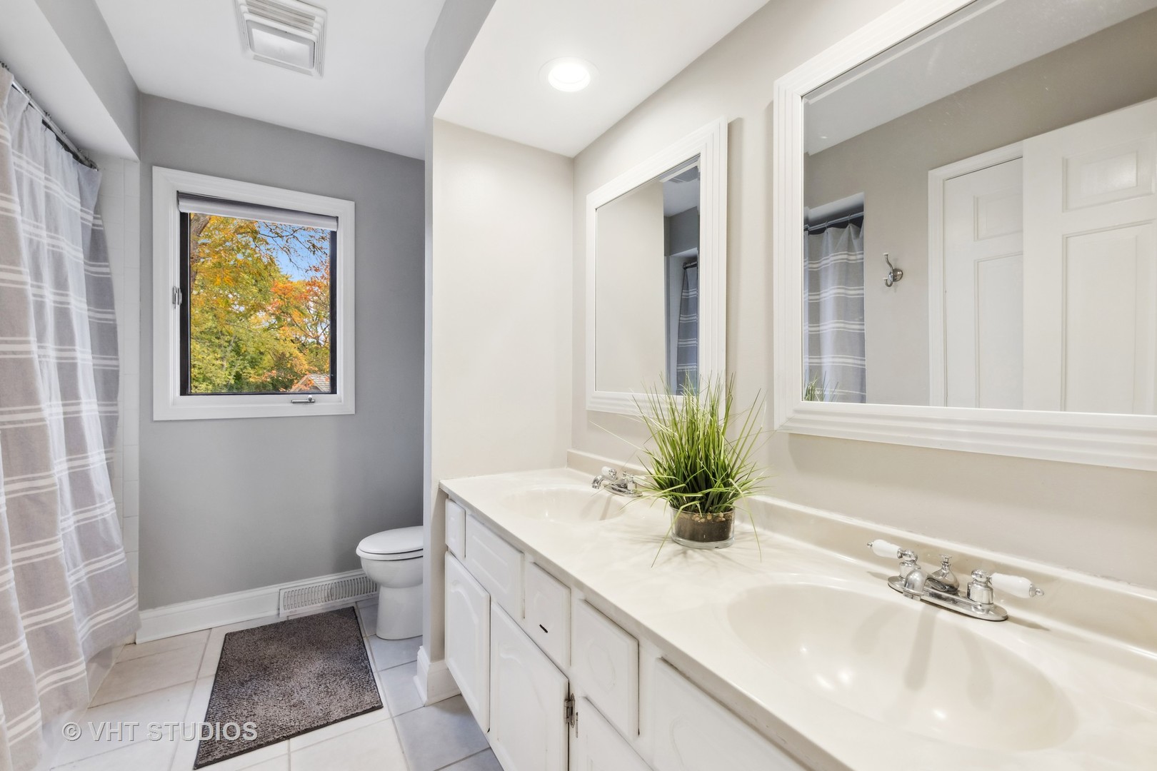 2S540 White Birch Lane Wheaton, IL 60189 - Photo 34 of 46 a bathroom with a granite countertop sink a toilet and a window
