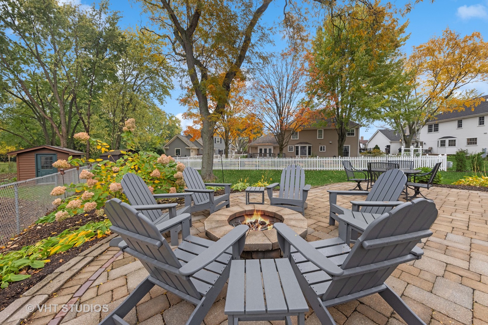 2S540 White Birch Lane Wheaton, IL 60189 - Photo 6 of 46 a view of a patio with couches table and chairs and wooden floor