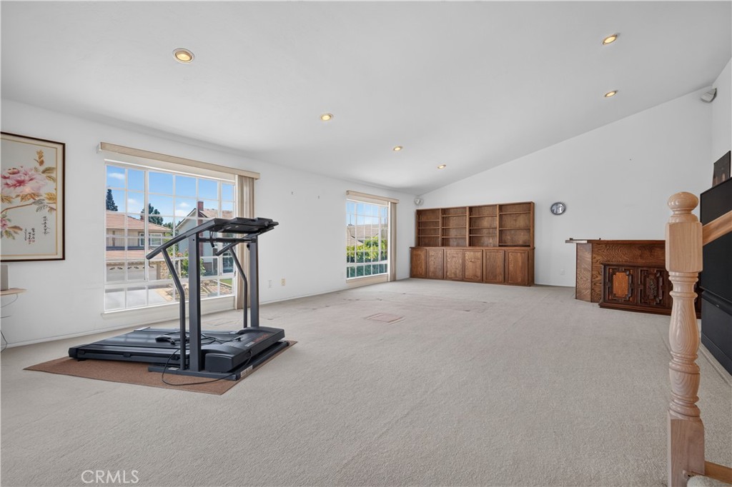 11719 Monte Leon Way Porter Ranch, CA 91326 - Photo 30 of 56 Family or Retreat Room with wet bar and fire place