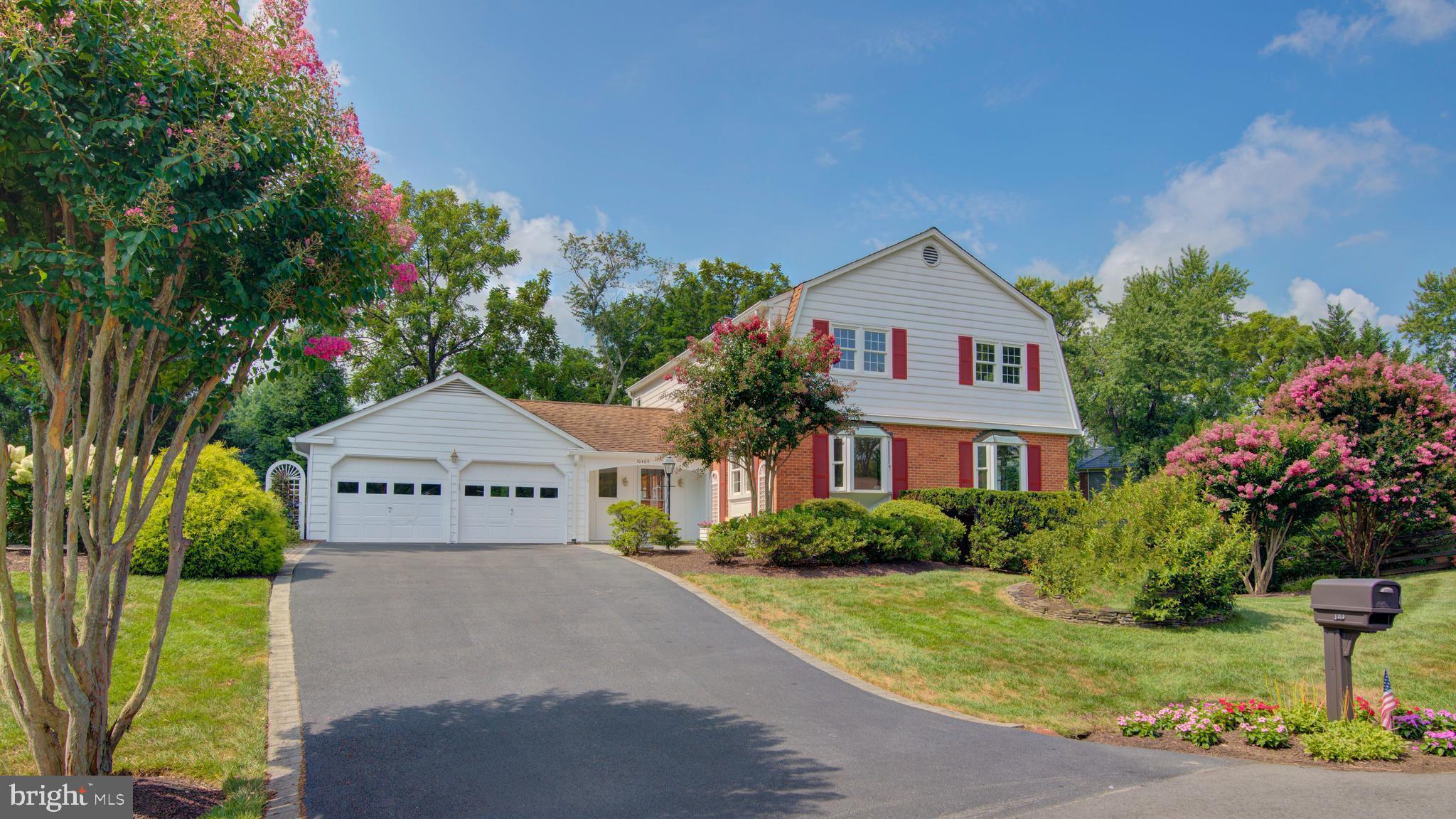10405 Trumpeter Court Vienna, VA 22182 - Photo 1 of 43 a front view of a house with garden