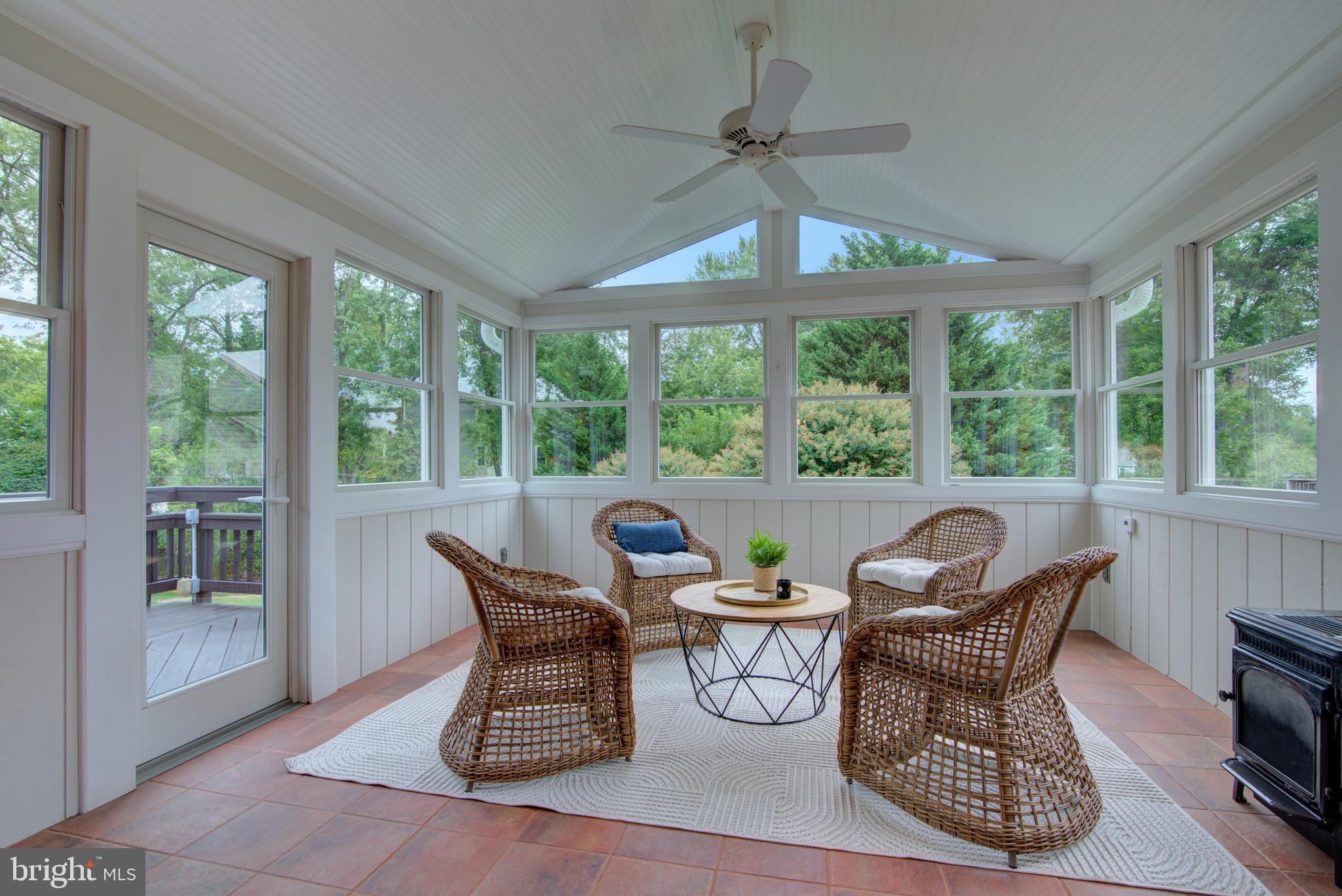 10405 Trumpeter Court Vienna, VA 22182 - Photo 13 of 43 a dining room with furniture large windows and a chandelier