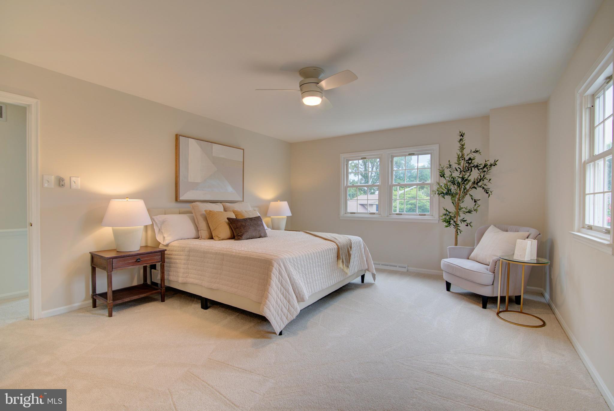 10405 Trumpeter Court Vienna, VA 22182 - Photo 20 of 43 a bed room with a bed and a chair