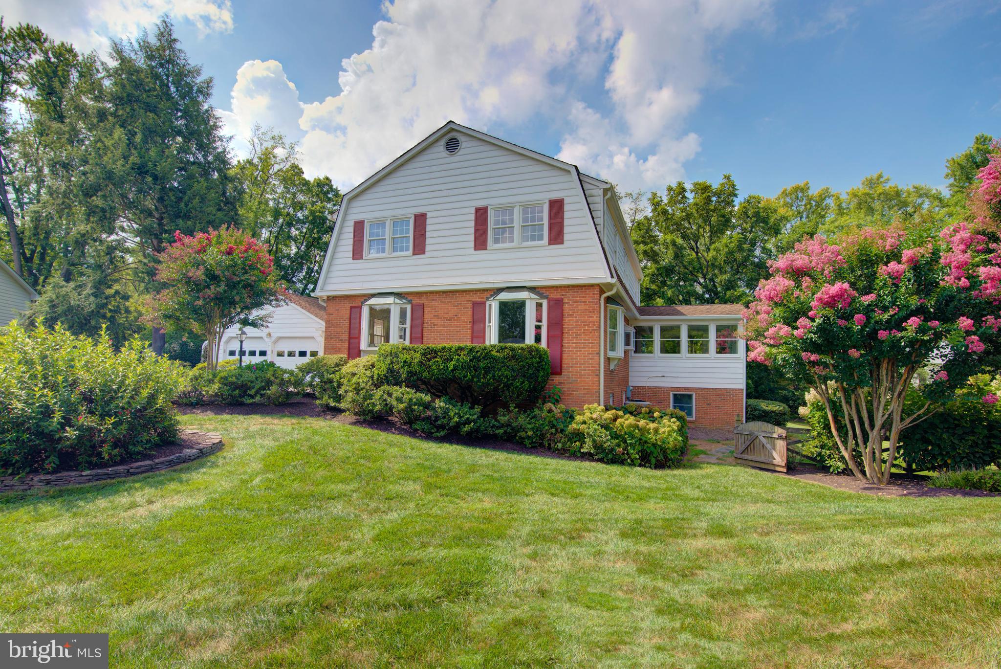 10405 Trumpeter Court Vienna, VA 22182 - Photo 2 of 43 a front view of a house with garden