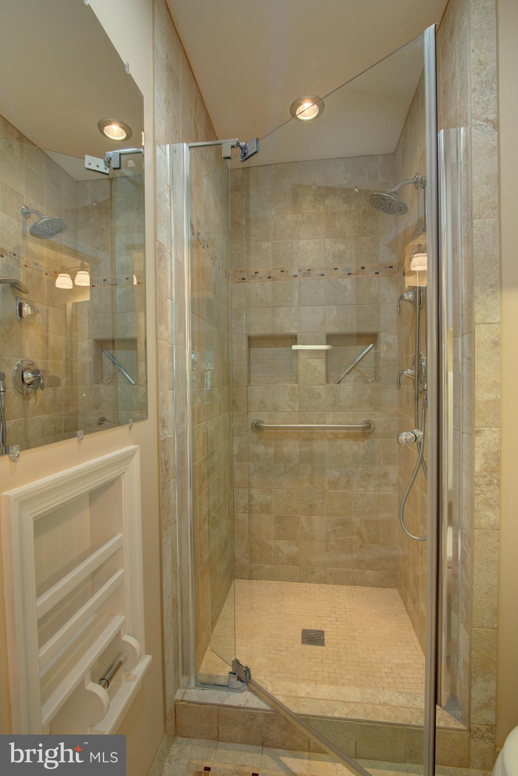 10405 Trumpeter Court Vienna, VA 22182 - Photo 22 of 43 a bathroom with a shower and a sink