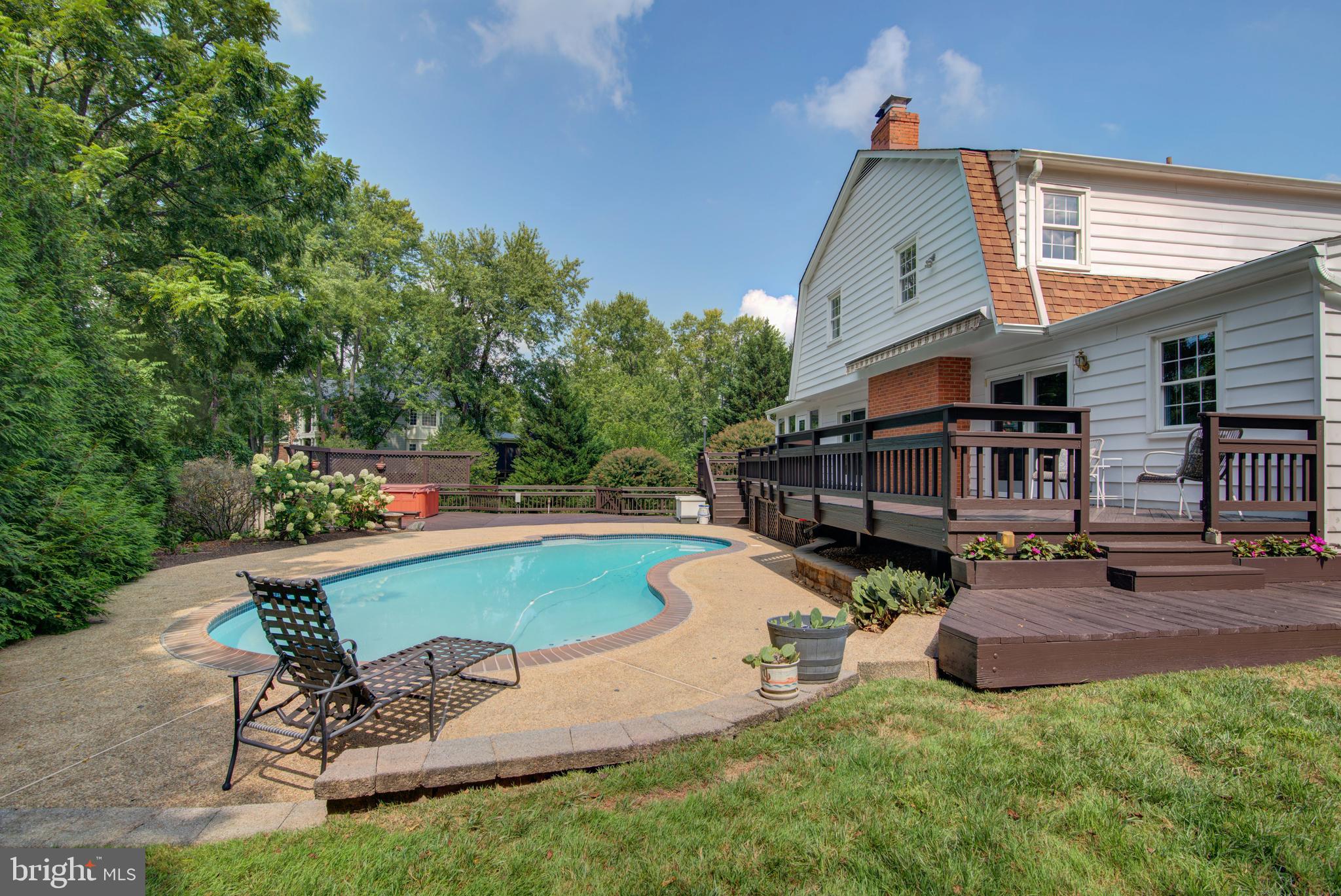 10405 Trumpeter Court Vienna, VA 22182 - Photo 36 of 43 a view of a backyard with sitting area and slide
