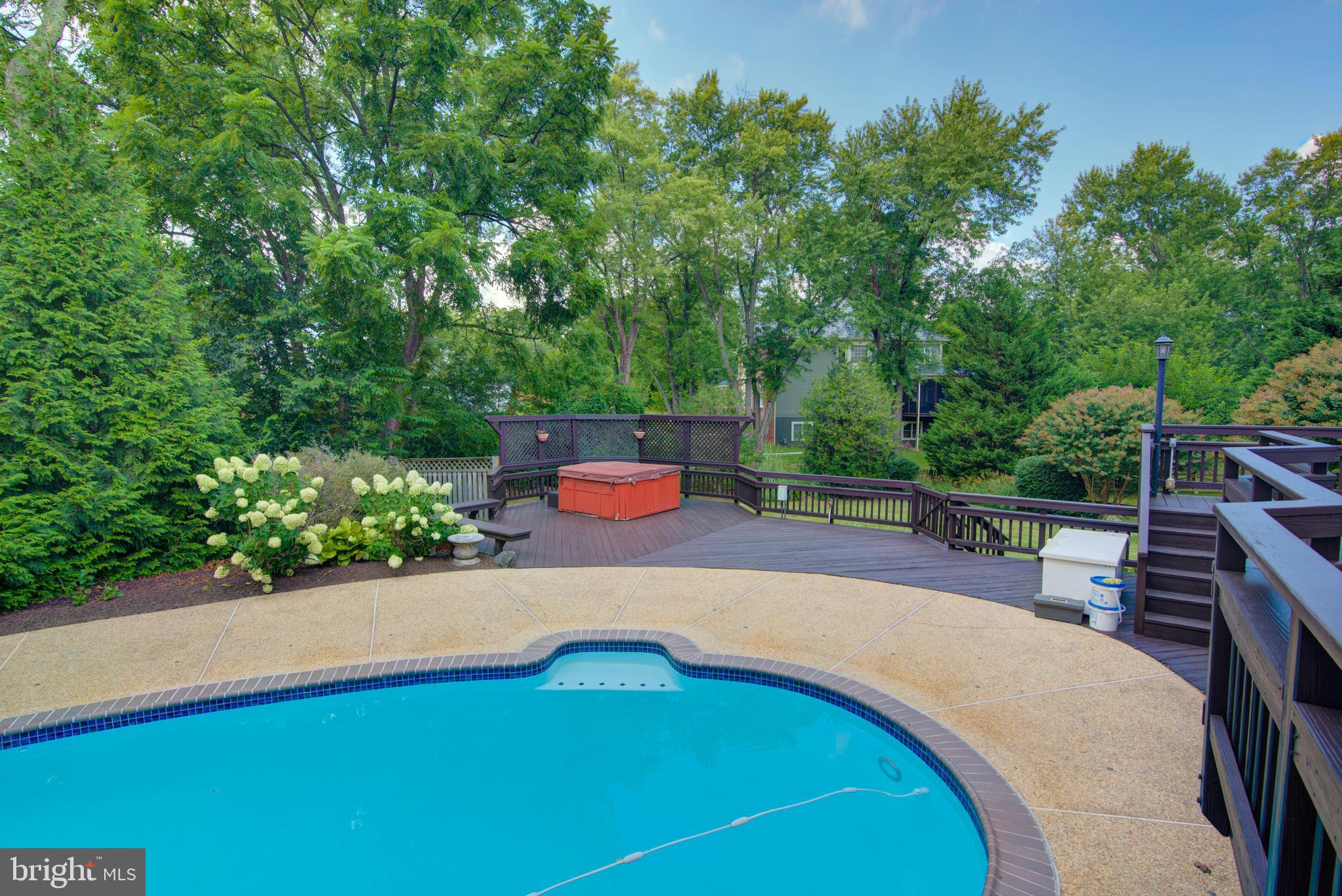 10405 Trumpeter Court Vienna, VA 22182 - Photo 37 of 43 a view of a swimming pool with a patio