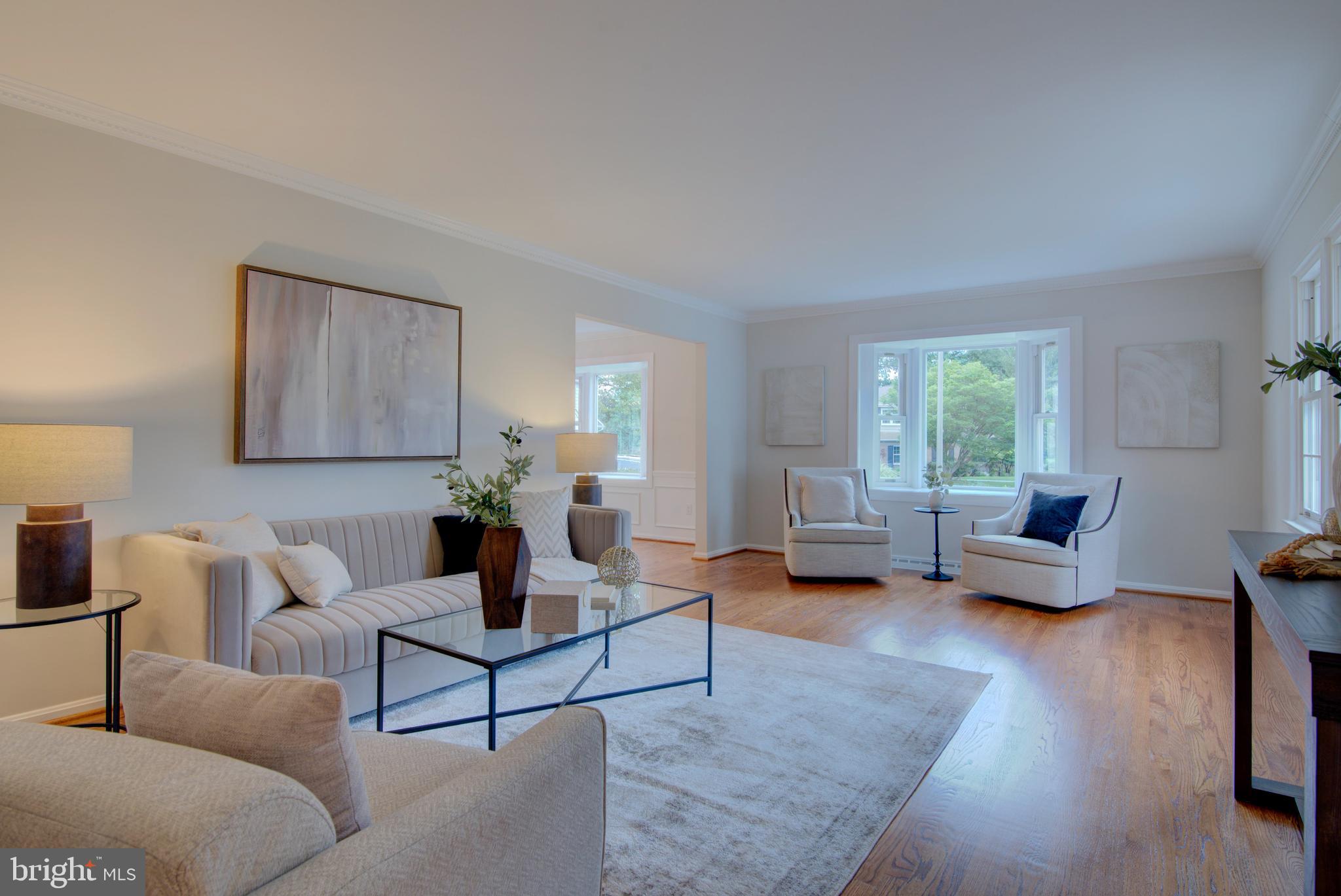 10405 Trumpeter Court Vienna, VA 22182 - Photo 4 of 43 a living room with furniture and a couch