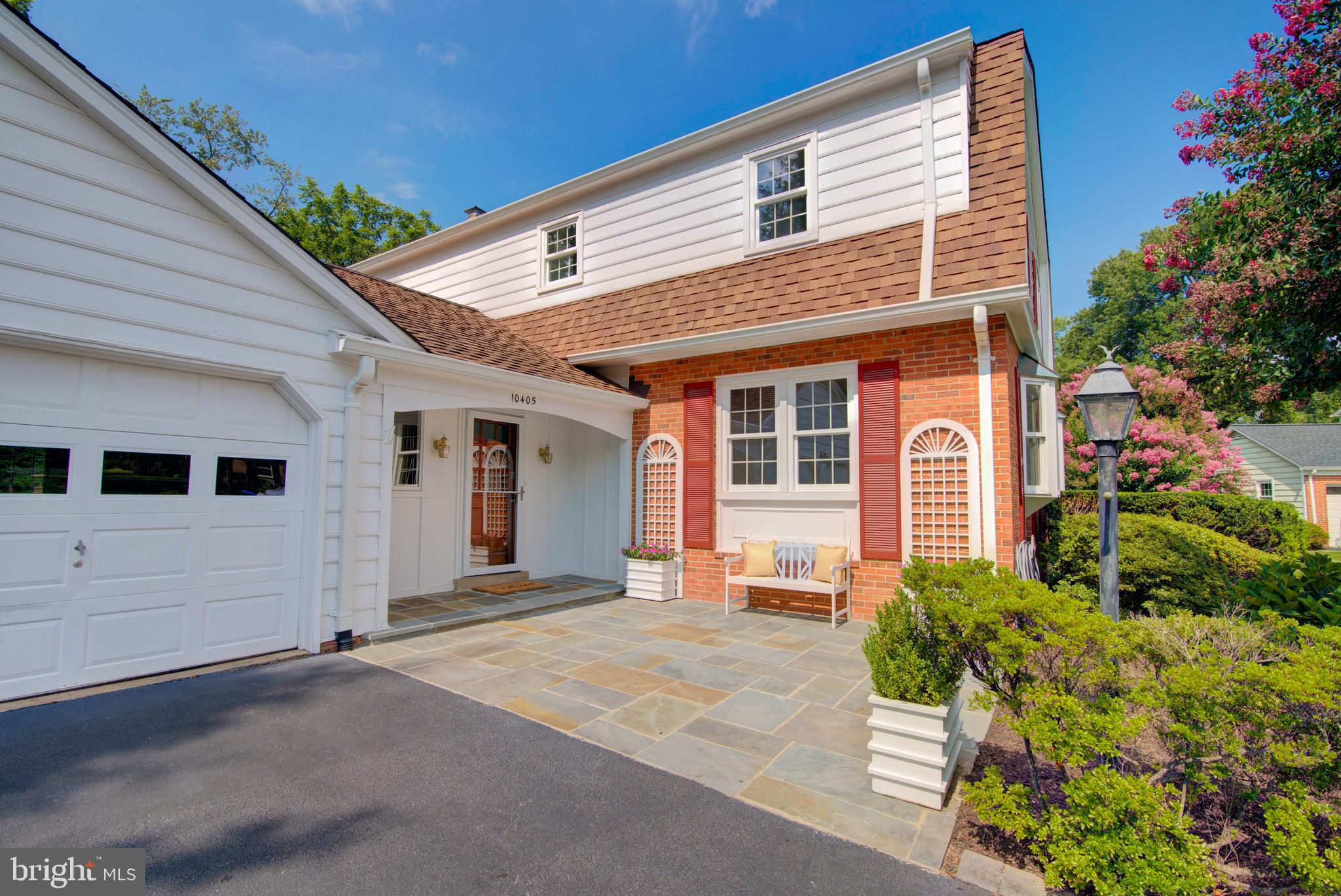 10405 Trumpeter Court Vienna, VA 22182 - Photo 43 of 43 a front view of a house with a garden