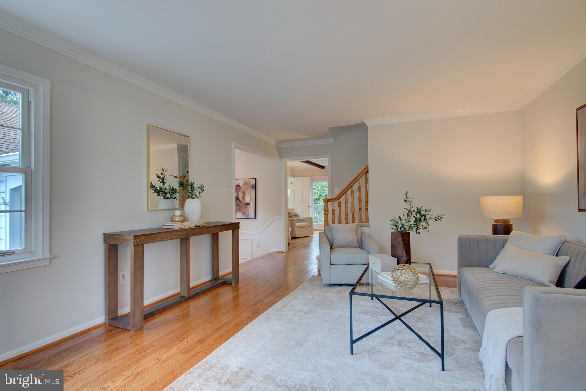 10405 Trumpeter Court Vienna, VA 22182 - Photo 6 of 43 a living room with furniture and a wooden floor