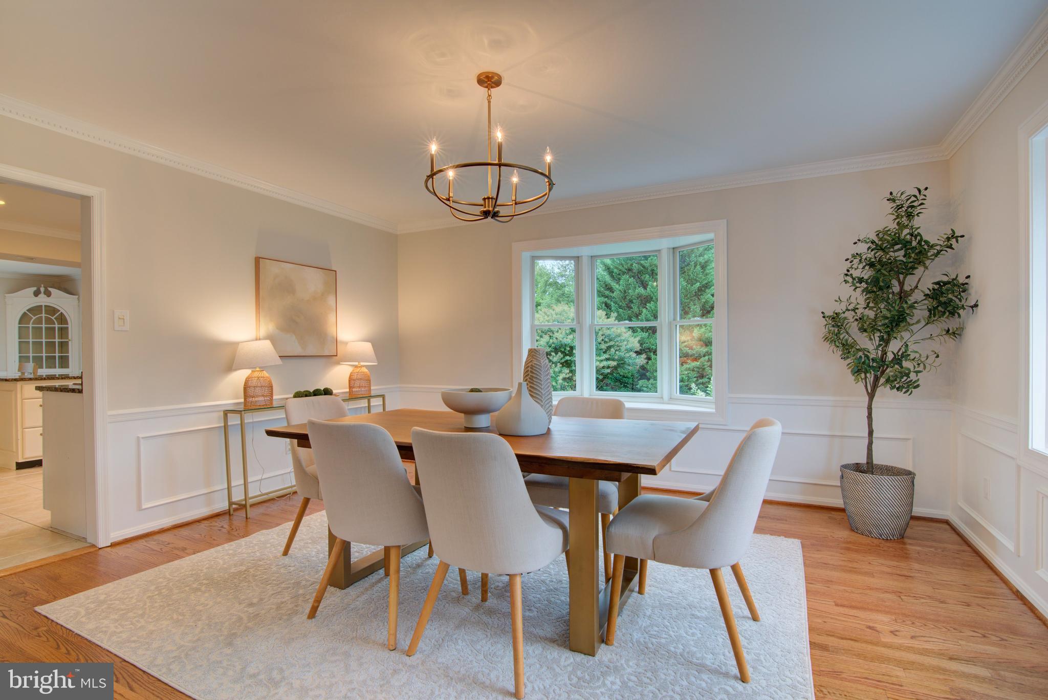 10405 Trumpeter Court Vienna, VA 22182 - Photo 7 of 43 a view of a dining room with furniture window and wooden floor
