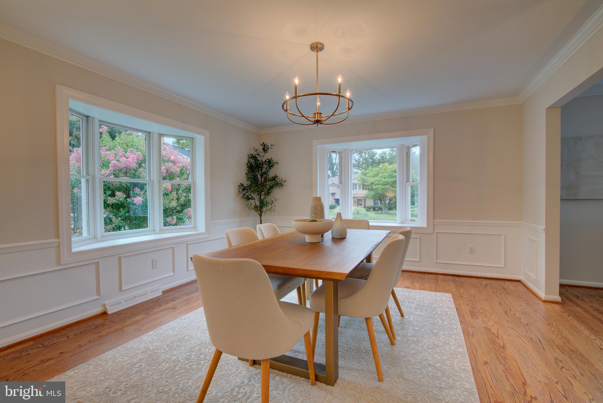 10405 Trumpeter Court Vienna, VA 22182 - Photo 9 of 43 a view of a dining room with furniture wooden floor and chandelier