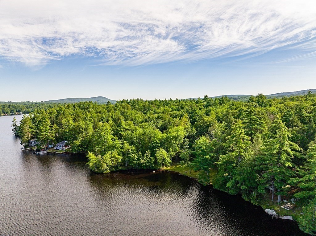 15 Browns Lake Road Ashburnham, MA 01430 - Photo 14 of 18 a view of a lake with a houses in the back