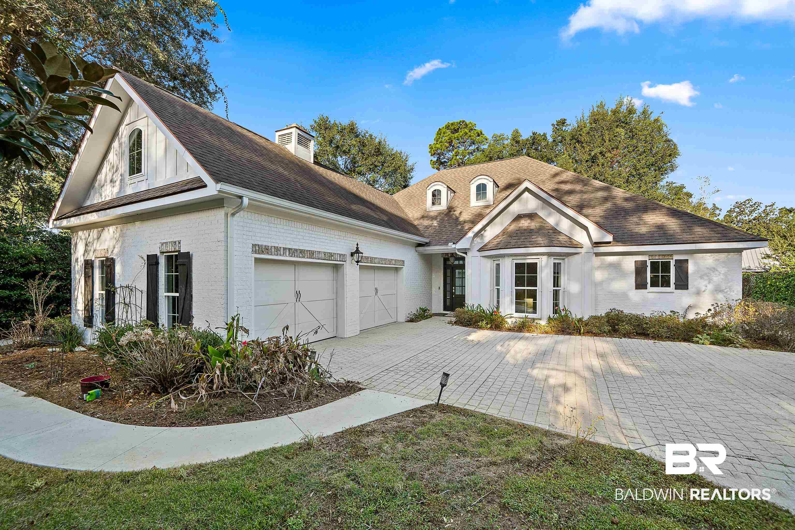 356 Liberty Street Fairhope, AL 36532 - Photo 1 of 39 View of front of property with brick siding, a garage, decorative driveway, and a shingled roof