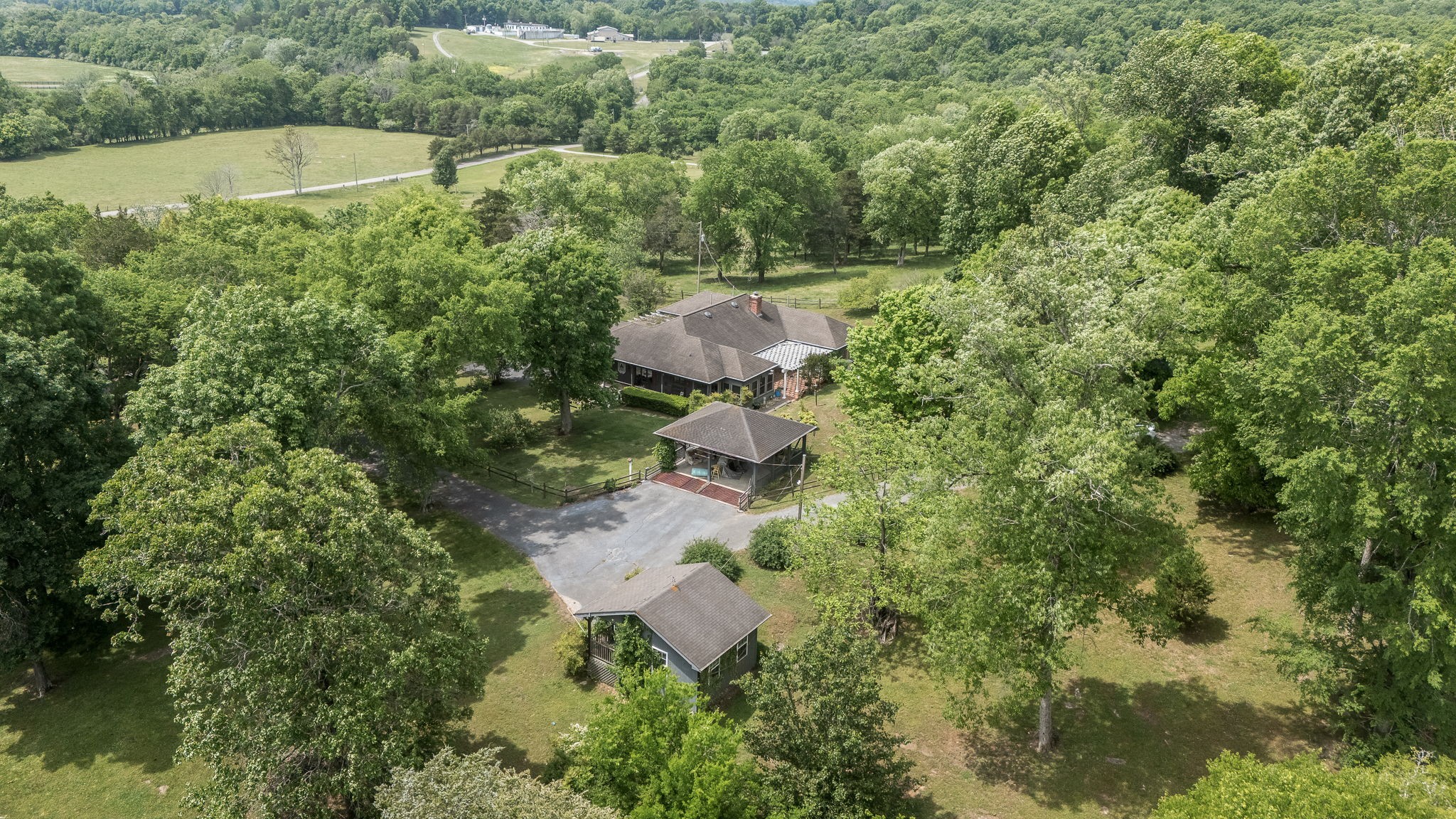32 Grisham Road Fayetteville, TN 37334 - Photo 4 of 15 an aerial view of a house with a yard and outdoor seating