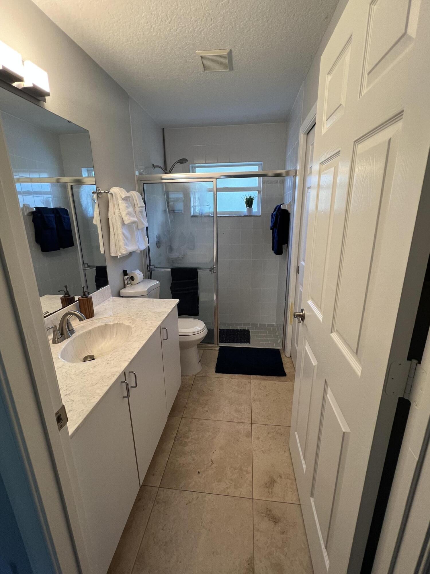 12809 53rd Road North Royal Palm Beach, FL 33411 - Photo 14 of 22 Master bed bathroom