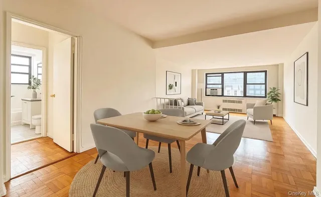 a view of a dining room with furniture and wooden floor