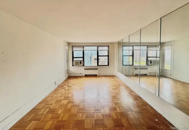 a bathroom with a tub and shower