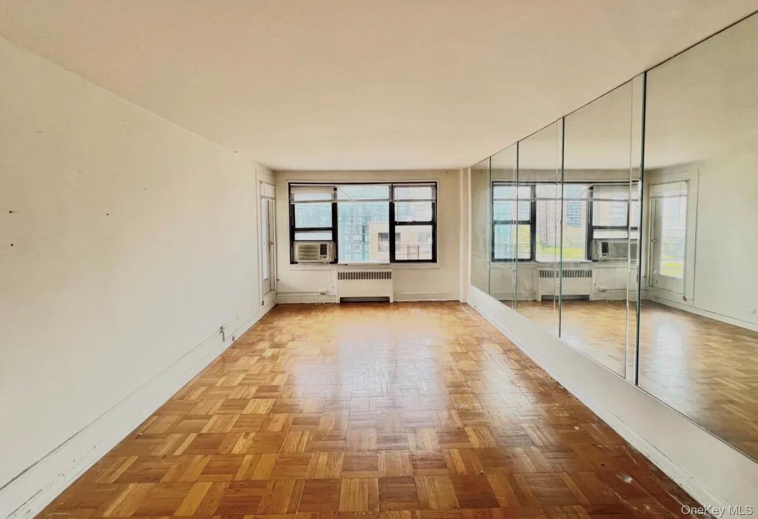 98-22 63rd Drive, Unit 7B Queens, NY 11374 - Photo 5 of 10 a bathroom with a tub and shower