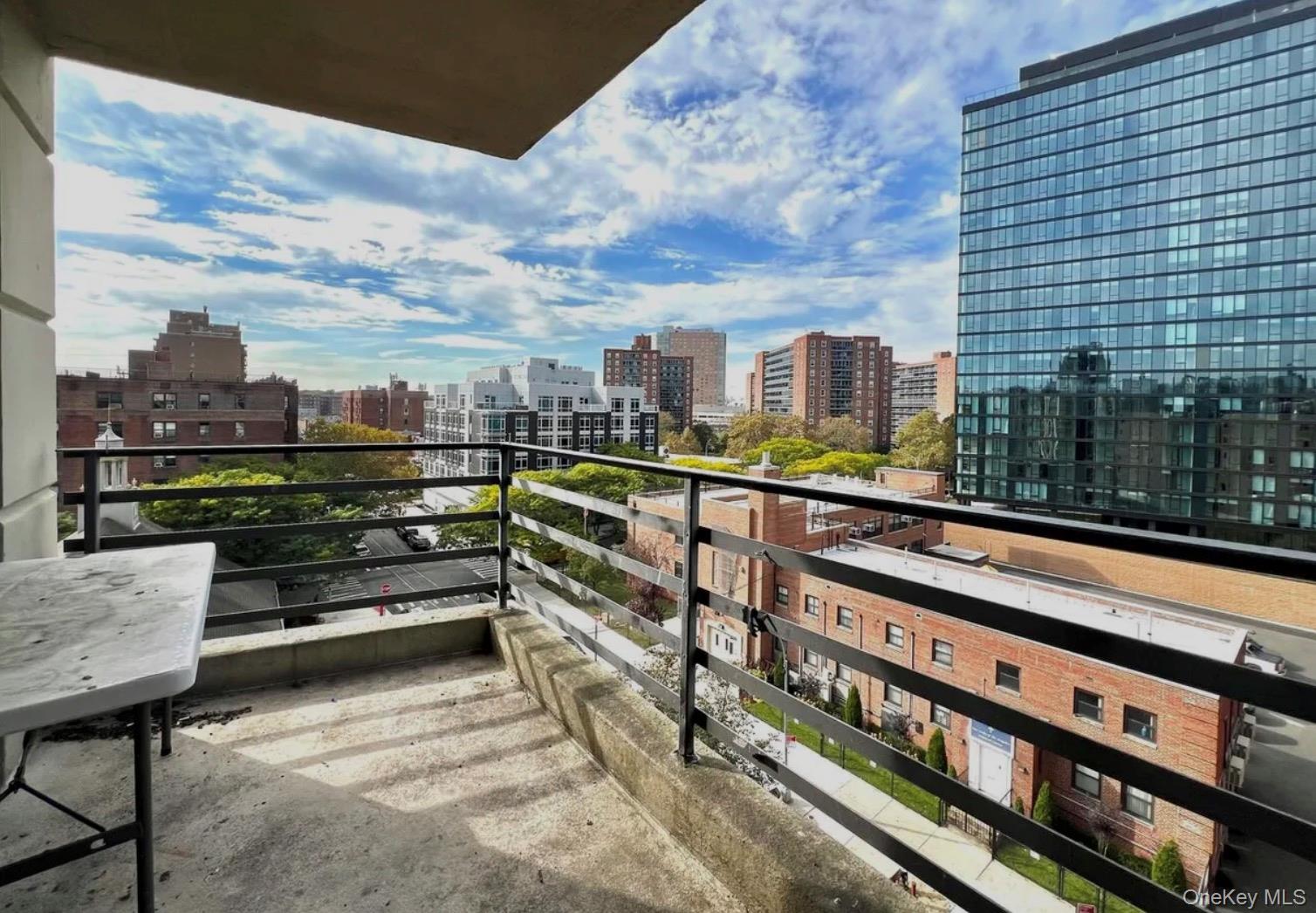98-22 63rd Drive, Unit 7B Queens, NY 11374 - Photo 10 of 10 a view of a balcony with chairs