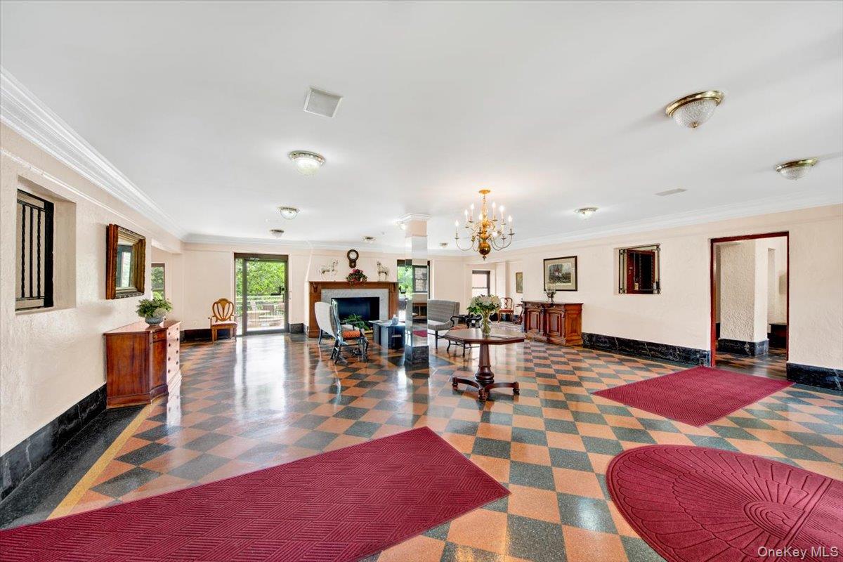 4784 Boston Post Road, Unit B43 Pelham, NY 10803 - Photo 16 of 22 a living room with fireplace furniture and wooden floor