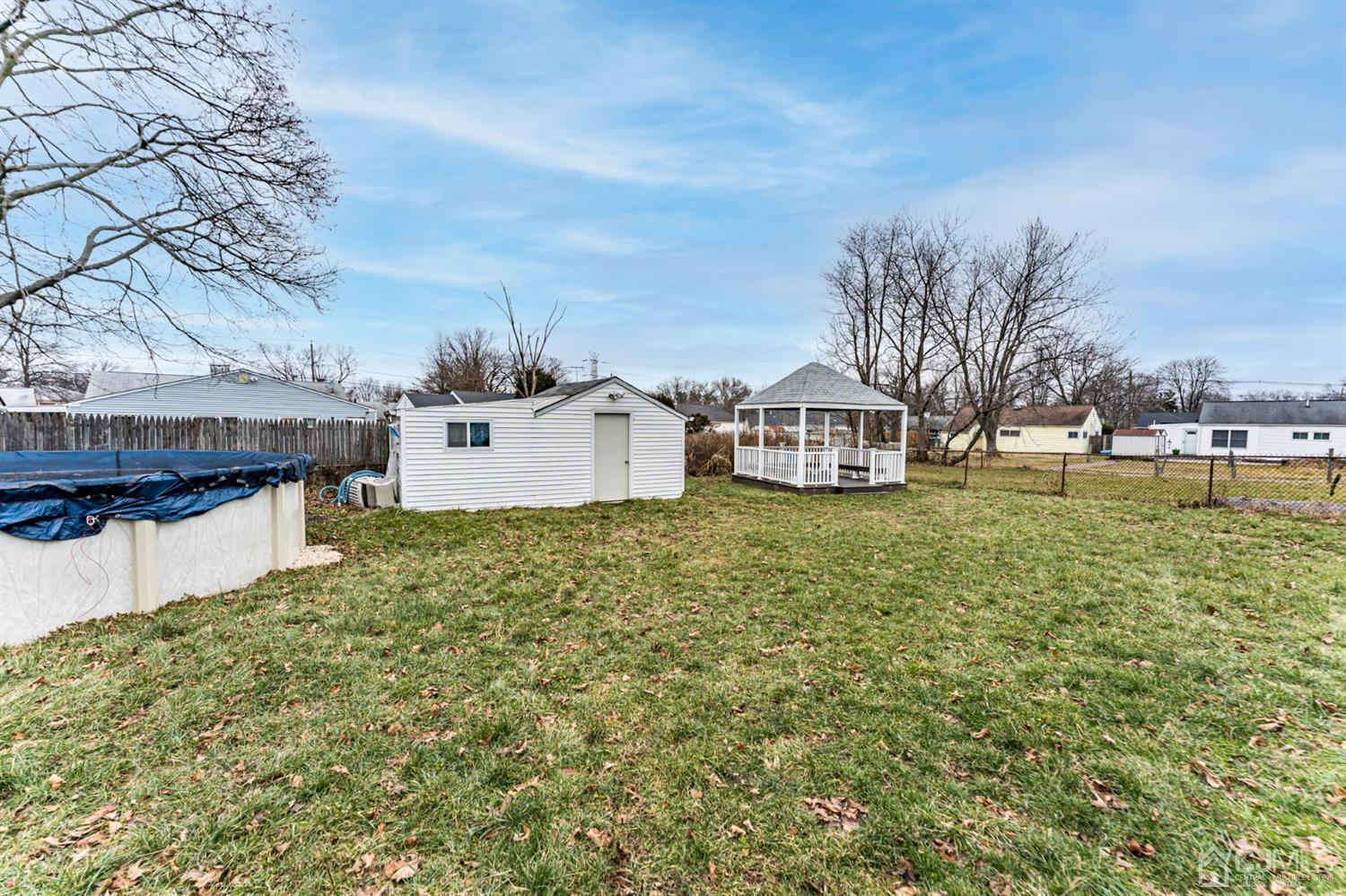 27 Fairfax Road Edison, NJ 08817 - Photo 22 of 25 a view of a house with a yard