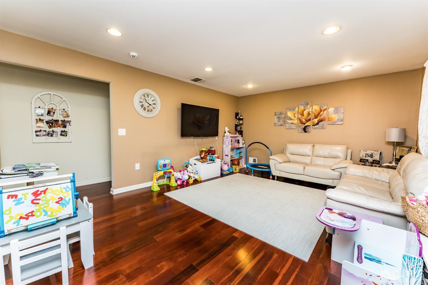 27 Fairfax Road Edison, NJ 08817 - Photo 5 of 25 a living room with furniture and a flat screen tv